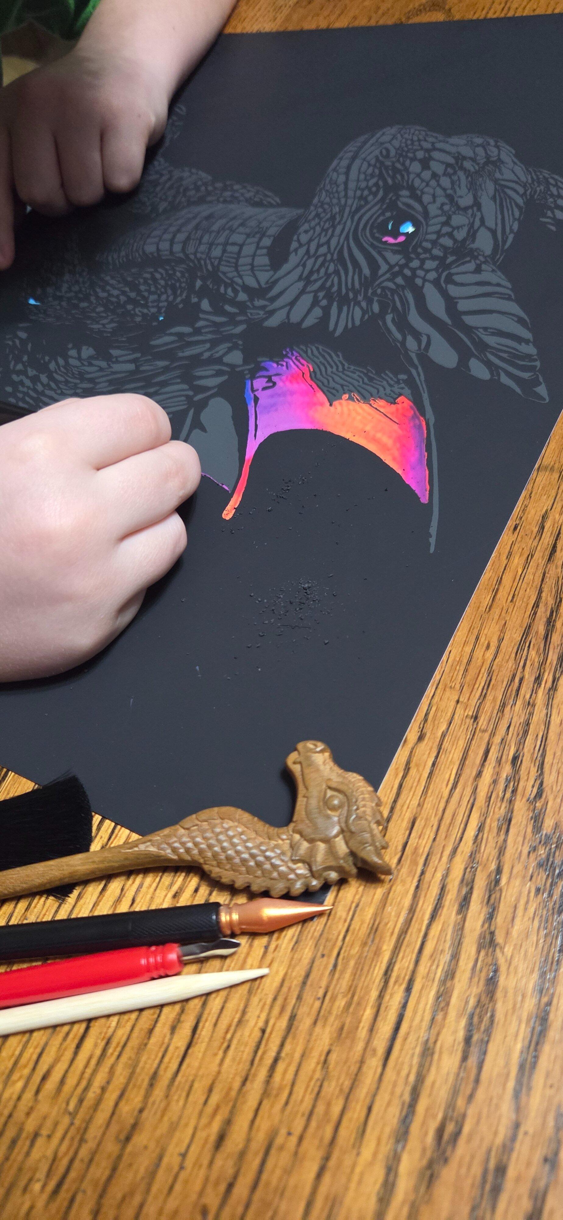 A customer photo of their finished scratch art