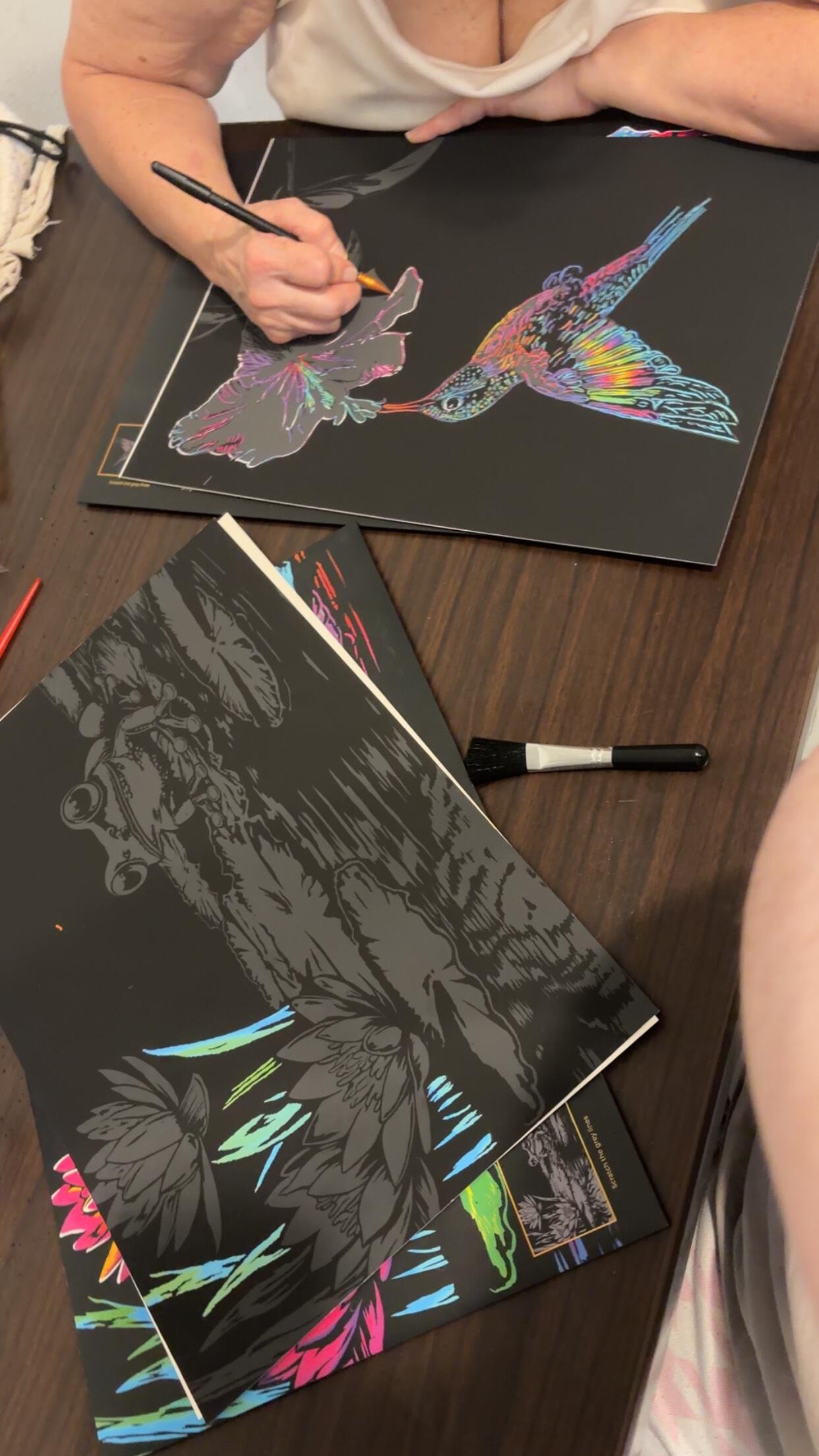 Finished Hummingbird canvas displayed on a wall